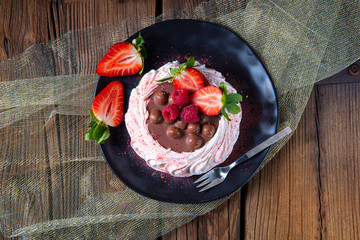 light pavlova with fresh fruits and chocolate