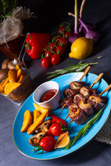 cattle shashlik skewers with grilled vegetables on a caucasian