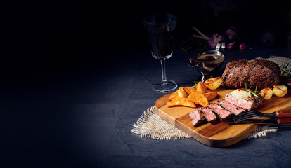 rustic medium butter beef steak with herbs and potato wedges