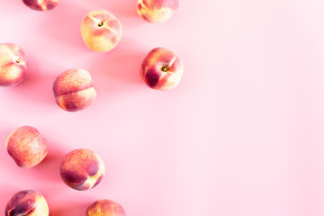 Peaches pattern. Fresh fruits background. Peach on pastel pink background. Flat lay, top view, copy space
