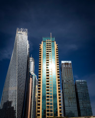 Fototapeta premium High-rise houses of modern futuristic design of Dubai Marina district.