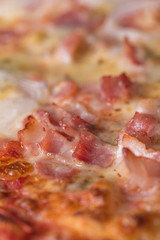 Pizza with bacon and cheese close up still