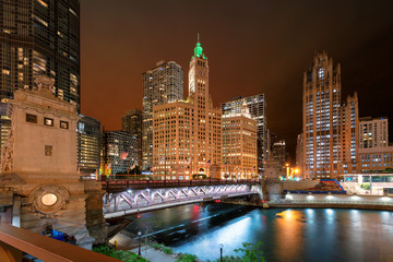 Chicago at night. Cityscape  of Chicago City and river with Du Sable bridge t night, Chicago, Illinois, USA.