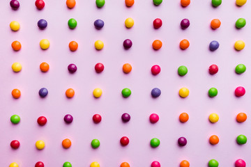 Colorful Candy bonbon snack set. Sweet pink background. Top view, flat lay