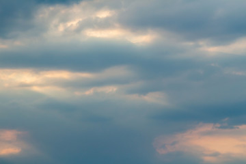Dramatic picturesque colorful skies with cloud and picturesque sunbeams before sunset