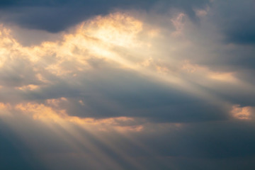 Dramatic picturesque colorful skies with cloud and picturesque sunbeams before sunset