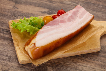 Smoked pork breast with salad leaves