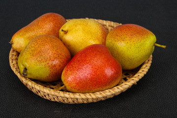 Pear heap in the wooden basket