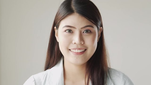portrait of young beautiful Asian woman smiling and happiness