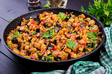 Ratatouille. Vegetarian stew  eggplants, bell peppers, onions, garlic and tomatoes with herbs.  Traditional french food.