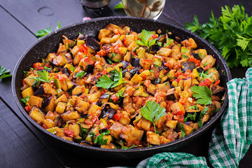 Ratatouille. Vegetarian stew  eggplants, bell peppers, onions, garlic and tomatoes with herbs. ...