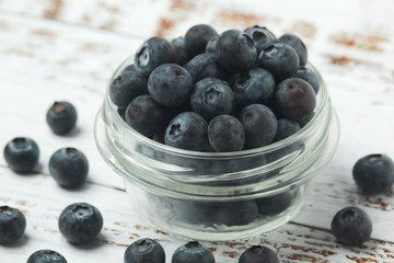 A glass bowl with blueberry