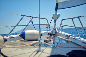 View of a sailing ship front deck and open sea.