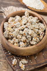 Peanuts roasted in honey and sesame seeds. Rustic style