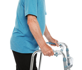 Elderly man using walking frame isolated on white, closeup