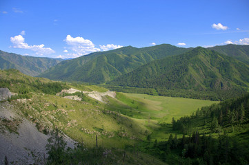 Picturesque fertile valley surrounded by high mountains. Altai, Siberia, Russia. Landscape.