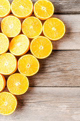 Overhead shot of fresh oranges on wooden background