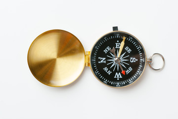 Golden vintage compass isolated on white background