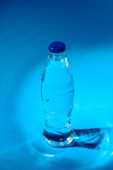 Water bottle close up on dark blue background