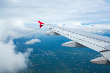 high view image through airplane window with nice clear blue sky