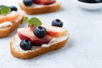 Bread toast with peach and blue berry