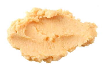 splash of chickpea hummus isolated on white background