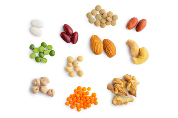 Mix of dry plant protein sources: beans, lentils, peas, chickpeas, and nuts. Isolated over white, clipping path at 300%