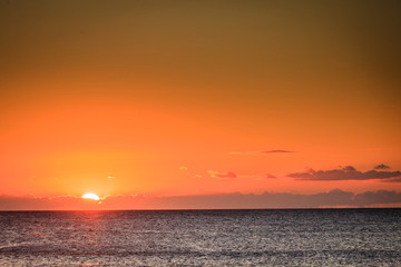 Sunset or sunrise over sea surface