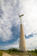 Fototapeta na wymiar Windmill in field at summer 