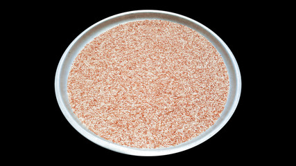 brown rice health food isolated with clipping path on black background, thailand