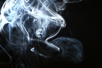 lovely swirl contrast blue smoke on the dark background.