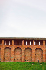 Fototapeta premium View on red brick wall and tower of Kolomna Kremlin, that was built in 1525-1531 by order of Tsar Vasily III. Russian history, sightseeing, ancient architecture. Vertical