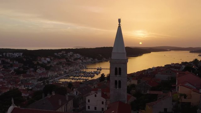 Cinematic aerial flying over Mali Losinj Croatia at sunset