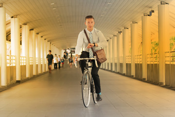 Businessman going to work by bicycle.