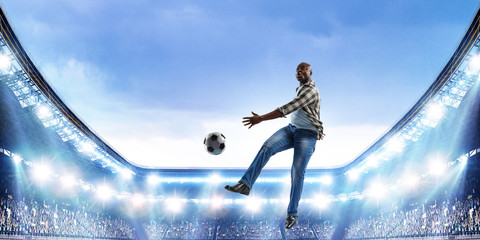 Fototapeta na wymiar Black man plays his best soccer match