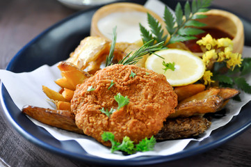 deep fried pork or fried pork ball with onion ring and french fries