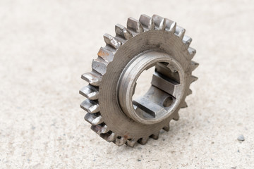 Broken teeth on the gear. Mechanical workshop and repair concept. Closeup and isolated.