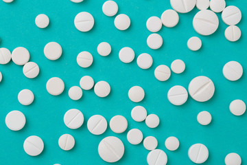 white  tablets on blue  background - Image .