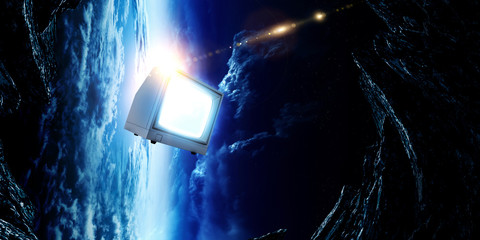Retro TV flying in space