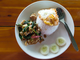 Top view. Fried rice with green curry chicken and fired egg, Popular thai food