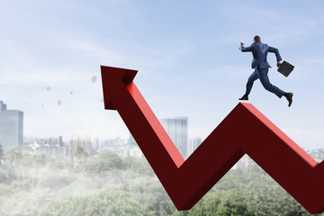 Black businessman running on red zigzag increasing arrow