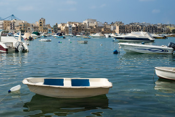 Fototapeta na wymiar Boats in the harbor in Malta