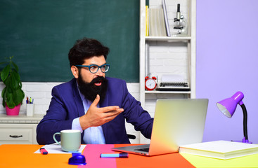 Surprised male student in auditorium. Educational process. Male student learning in classroom. Teacher. Education, knowledge concept. Coffee break. Back to school. Student thinking about coursework.