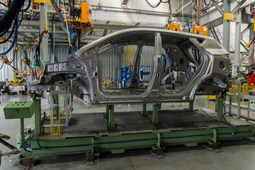 Metal car body on the production line at the car Assembly plant.
