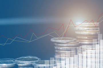 Double exposure of city and rows of coins for money, finance and business concept of teamwork and...