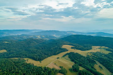 Obraz premium Mountain landscape with forests and meadows_1