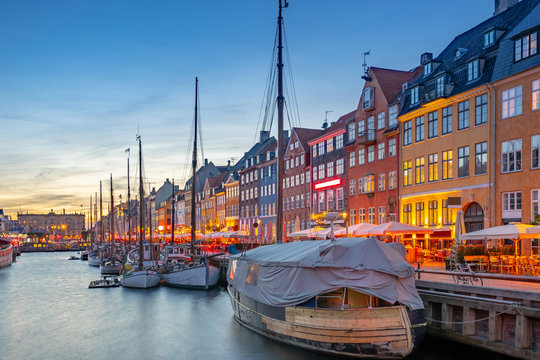 Nyhavn landmark buildings at night in Copenhagen city, Denmark
