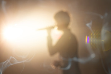blurred background of singer on concert stage