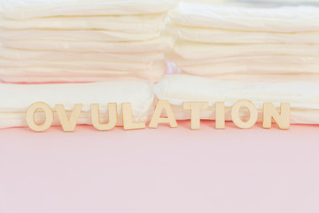 Word in front of sanitary towels pile