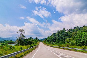 empty road in the middle of tropical forest at Fraser Hill, Malaysia